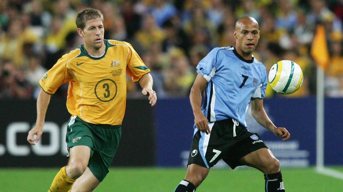 KEEPING CHIPPER: Former Socceroo Scott Chipperfield, seen here in action against Uruguay, believes Wollongong will be part of the A-League.