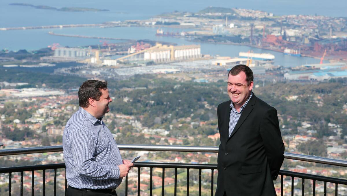 A NEW FUTURE: Illawarra Mercury editor Julian O'Brien (left) and Destination Wollongong's Mark Sleigh with Port Kembla in the background. Picture: Adam McLean.