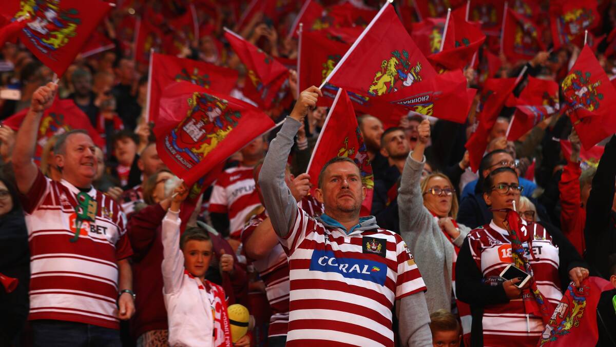 CHERRY RED ARMY: A typical group of Wigan Warriors supporters. Picture: Getty Images.