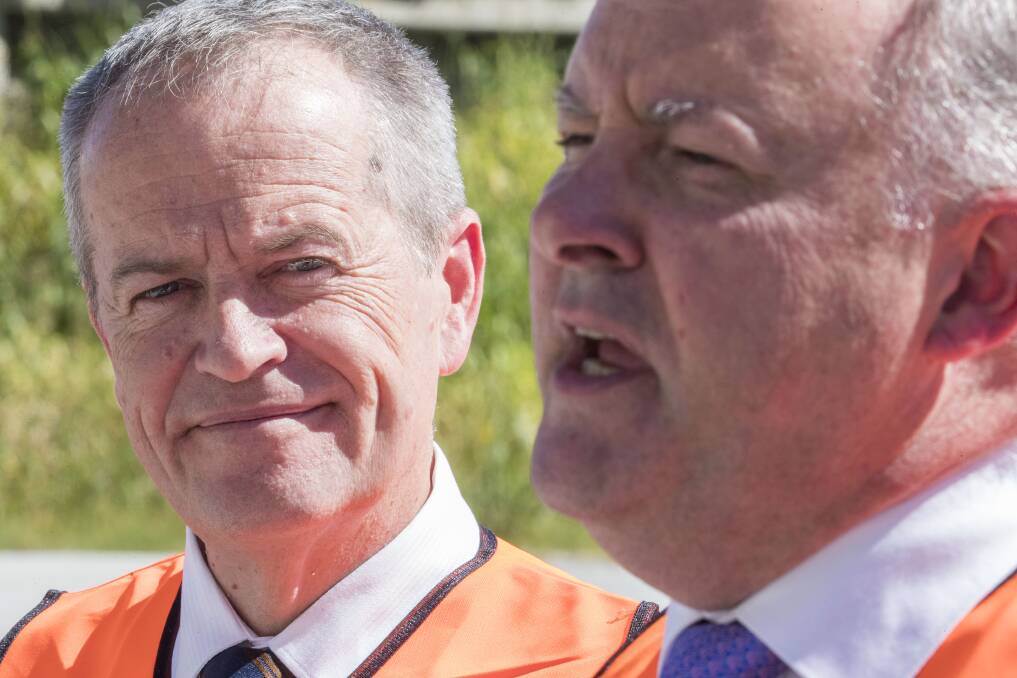 Federal Opposition Leader Bill Shorten (left) and Shadow Minister for Transport and Infrastructure Anthony Albanese speak to media in Brisbane on April 16. Picture: Glenn Hunt/AAP