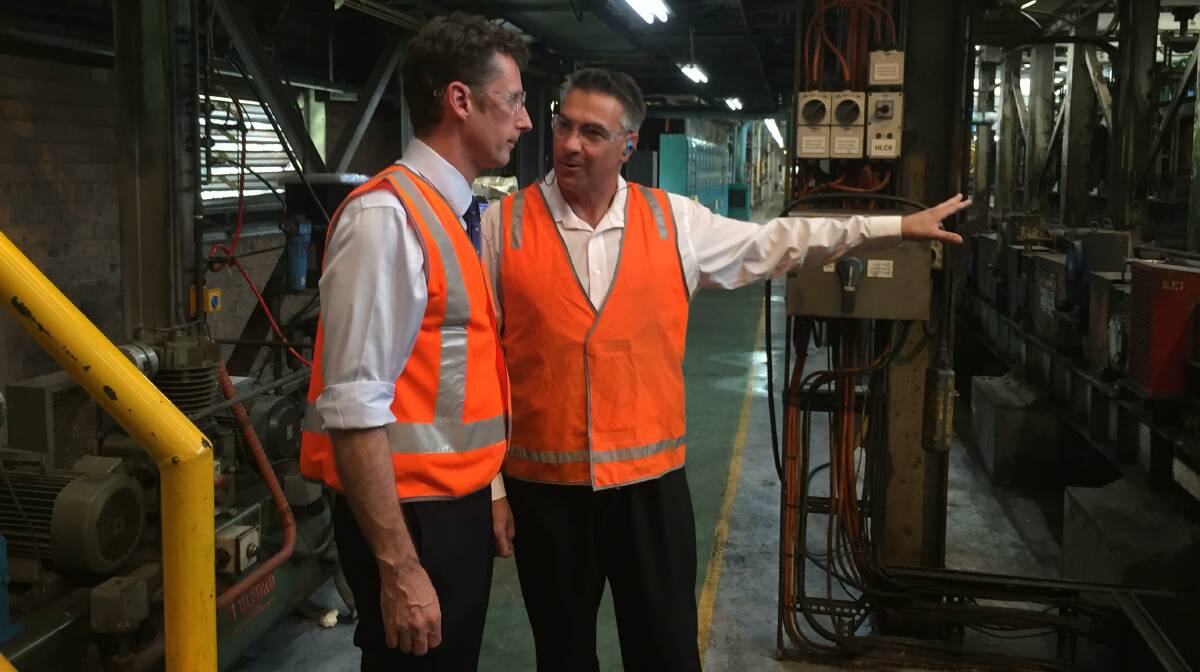 Throsby MP Stephen Jones is shown around Unanderra's Bisalloy Steel by production manager Andrew Huckstepp on Wednesday morning. Picture: Andrew Pearson