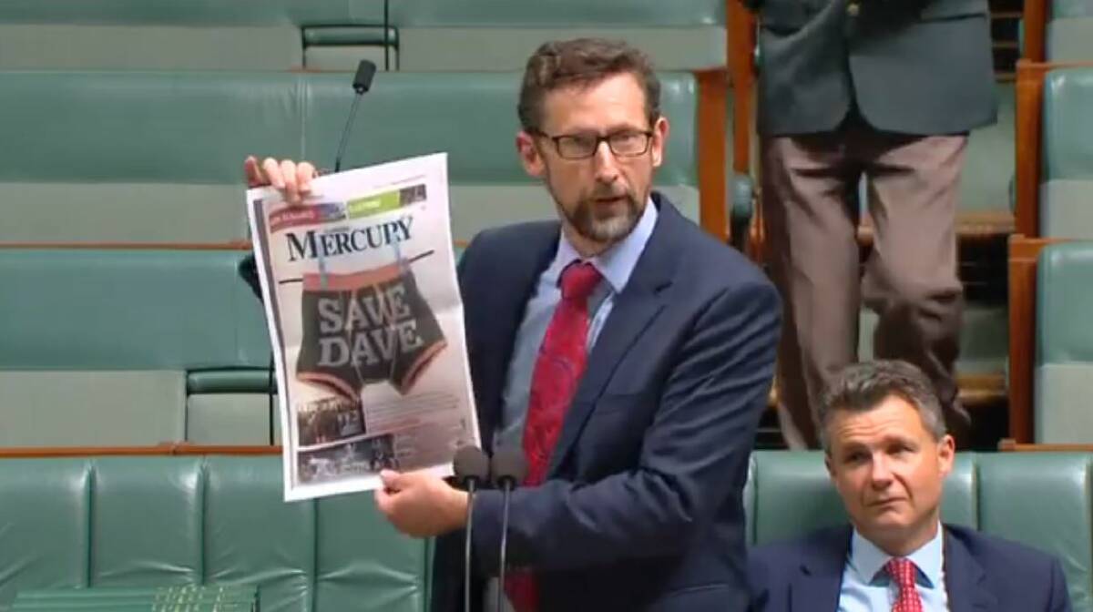 Whitlam MP Stephen Jones holds a copy of the Mercury's May 5 front page during his speech about sacked Appin miner Dave McLachlan in Parliament last week. 