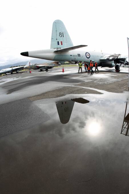 WINGS CLIPPED: Water pools on the tarmac at the Illawarra Regional Airport, prompting the cancellation of last year's Wings Over Illawarra air show. The weather forecast for this weekend's event is, at this stage, wet. Picture: Greg Totman