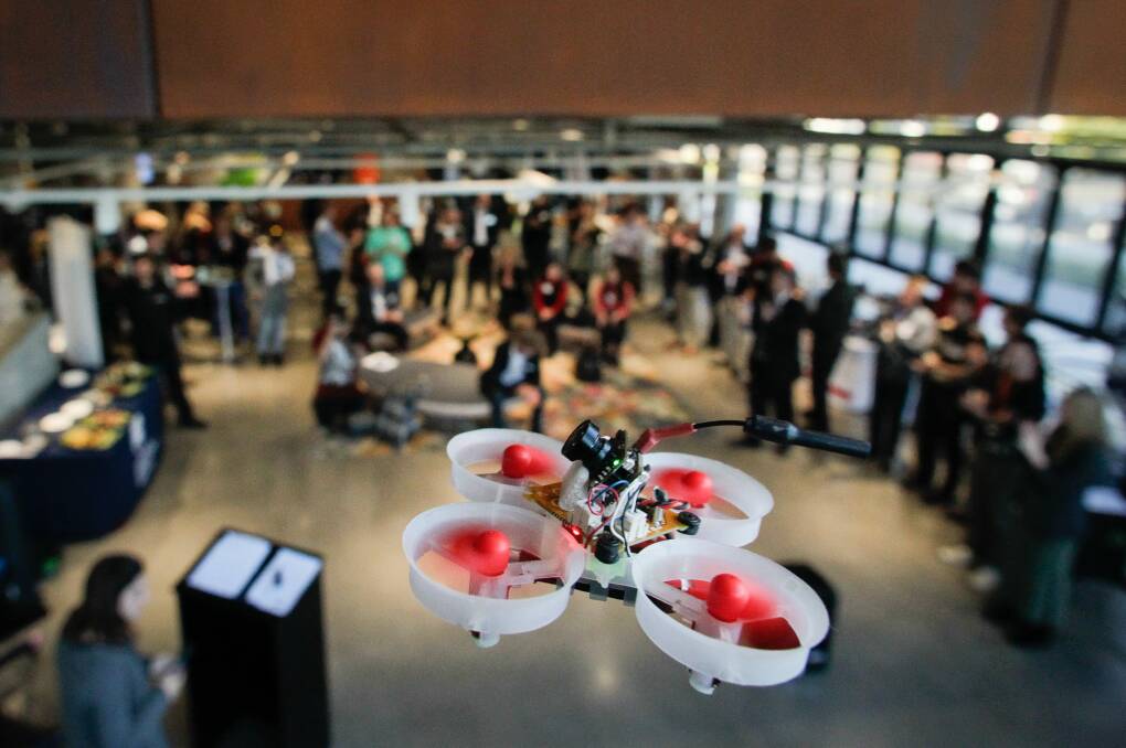 SKY-HIGH: Me3D representatives fly micro drones during a drones for business event at the University of Wollongong's Innovation Campus on Thursday. Picture: Adam McLean