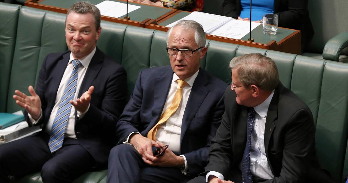 Leader of the House Christopher Pyne, Prime Minister Malcolm Turnbull and Industry Minister Ian Macfarlane in discussion during Question Time at Parliament House in Canberra on Thursday. Mr Pyne was appointed to the Industry portfolio and Mr Macfarlane dumped from the ministry during a Cabinet reshuffle on Sunday afternoon. Photo: Alex Ellinghausen

