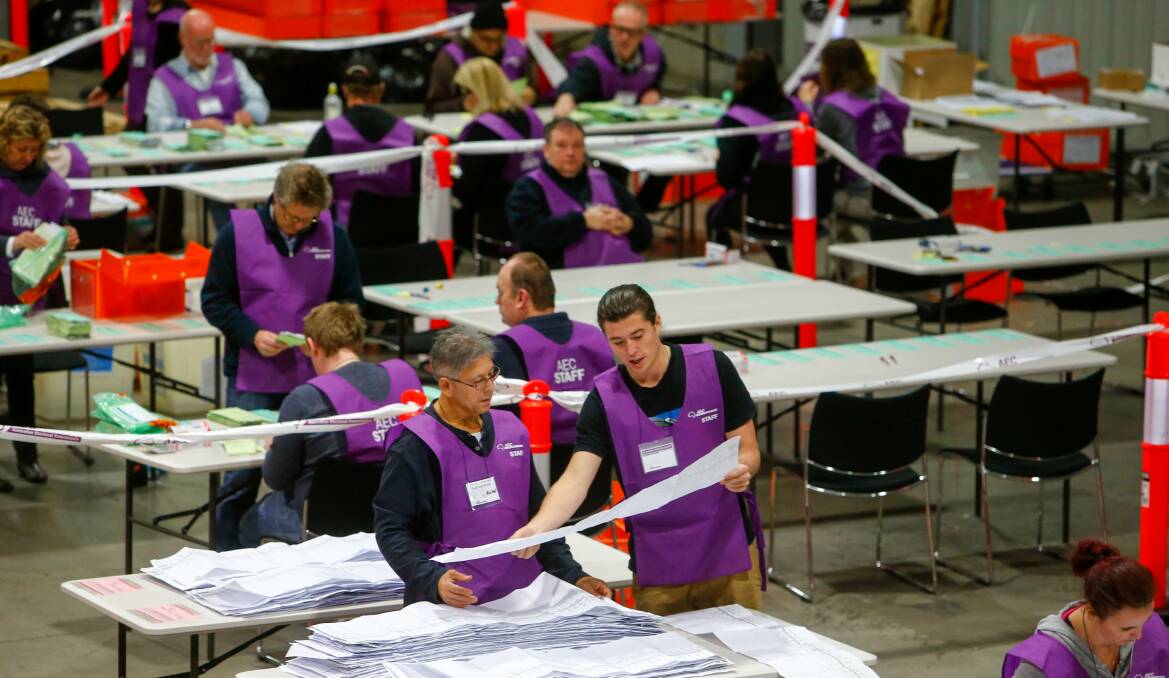 ONGOING: Ballot paper sorting and counting continues at a Warrawong warehouse on Wednesday. An outcome of the 2016 federal election, including who'll be the Member for Gilmore, won't be known for weeks. Picture: Adam McLean 