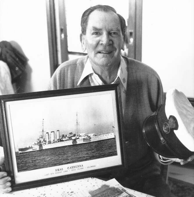 A 1989 photo of Mr Keys with a picture of HMAS Canberra.