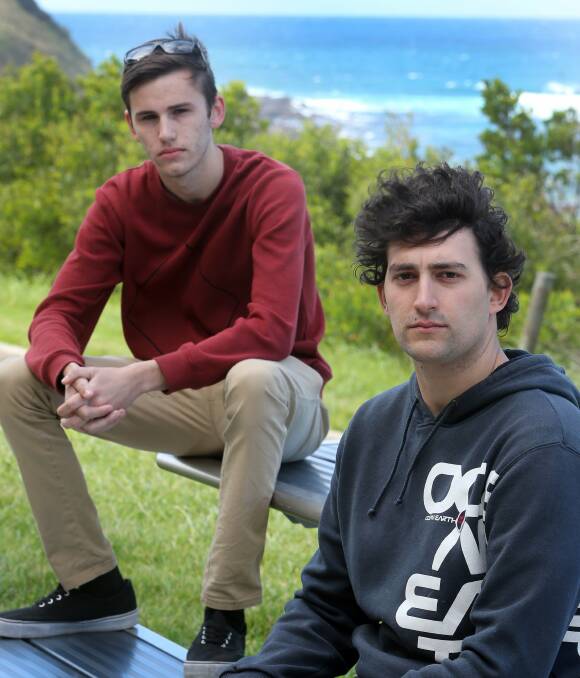 Port Kembla Surf Club members Daniel Burrell, 19, and Matthew Bergner, 25, outside the club after being briefed about the club's future. Picture: Robert Peet

