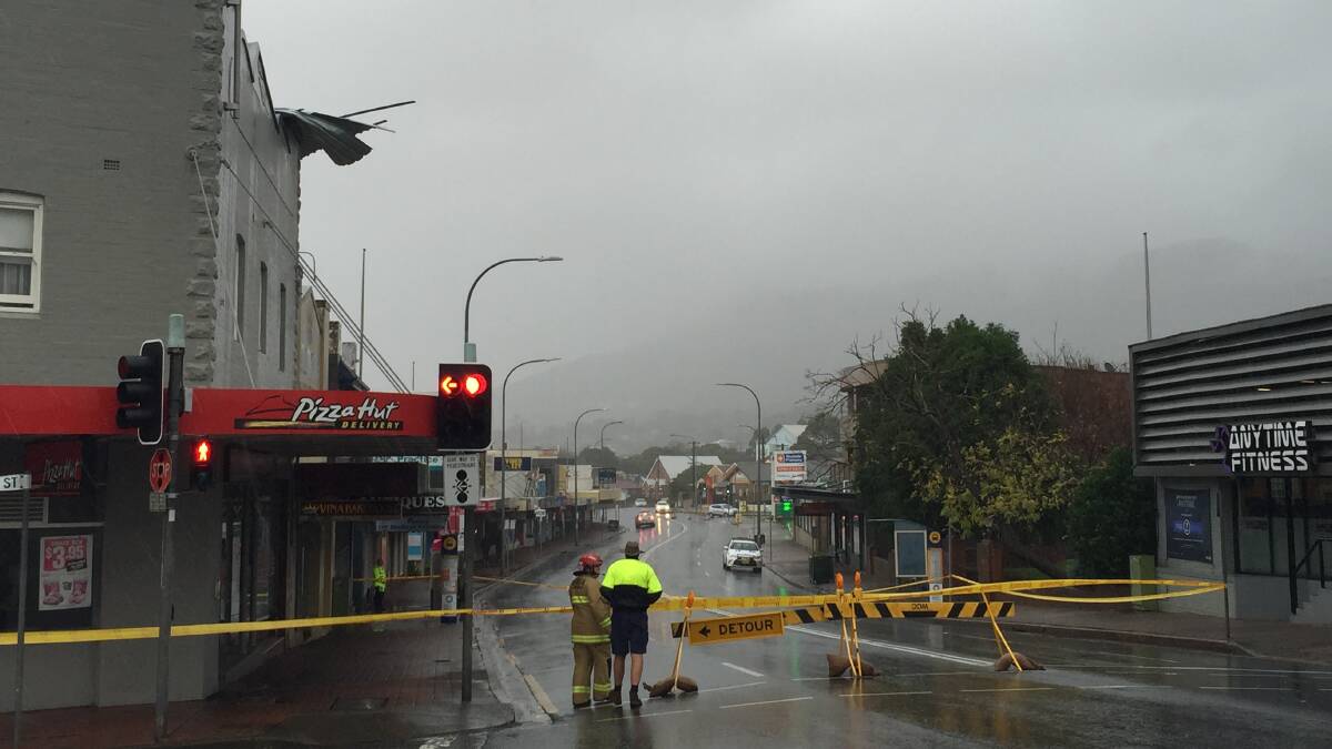 Emergency services monitor the situation at Pizza Hut Woonona. Princes Highway closed. Picture: Angela Thompson