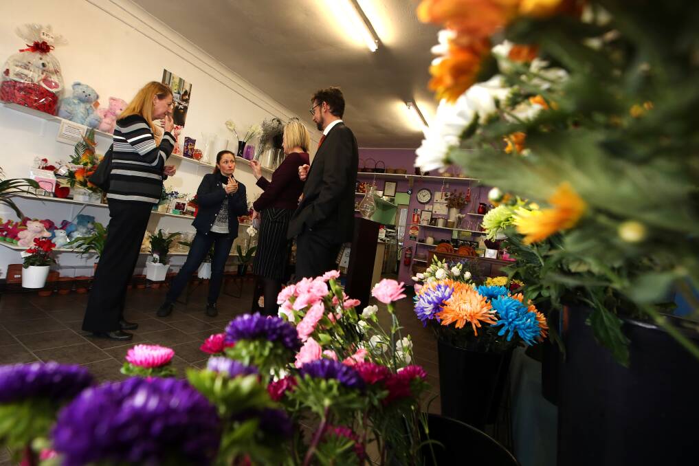 Labor's small business spokeswoman Katy Gallagher meets Unanderra Flower Shop owner Susana Martins. Picture: Sylvia Liber