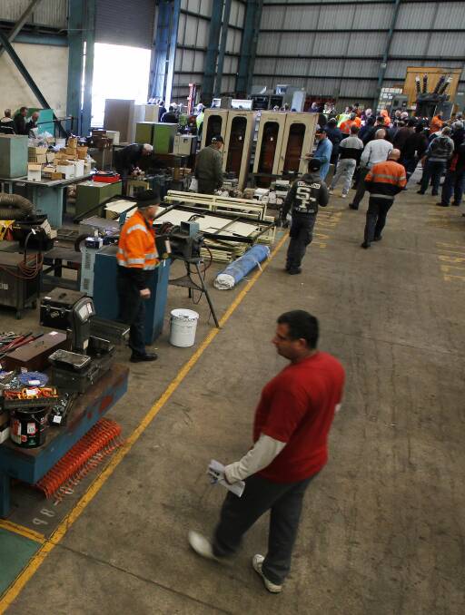 SALE TIME: Potential buyers browse hundreds of items on offer at an auction of surplus equipment from BlueScope's Port Kembla steelworks on Wednesday. Picture: Sylvia Liber