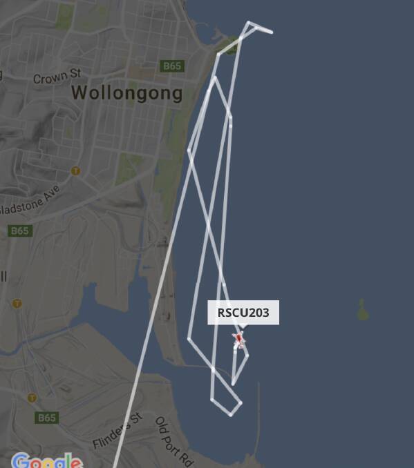 The NSW Ambulance helicopter, Rescue 203, searching the water between Flagstaff Hill and the entrance to Port Kembla harbour on Sunday night. Picture: Flightradar24