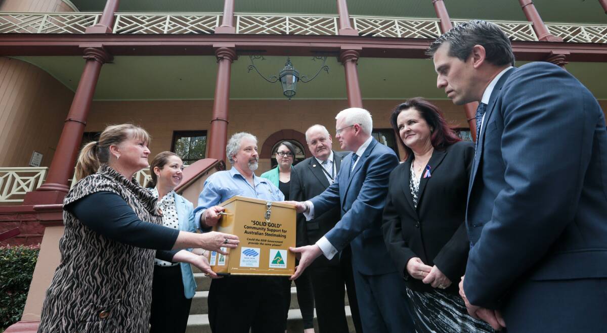 OVER TO YOU: Illawarra state politicians receive the community steel petition at NSW Parliament House in Sydney. Pictures: Adam McLean.