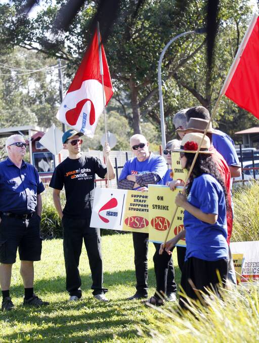 TAFE staff gather outside Wollongong campus on Thursday as part of a three-hour stop work in protest of proposed cuts to conditions. Picture: Sylvia Liber 
