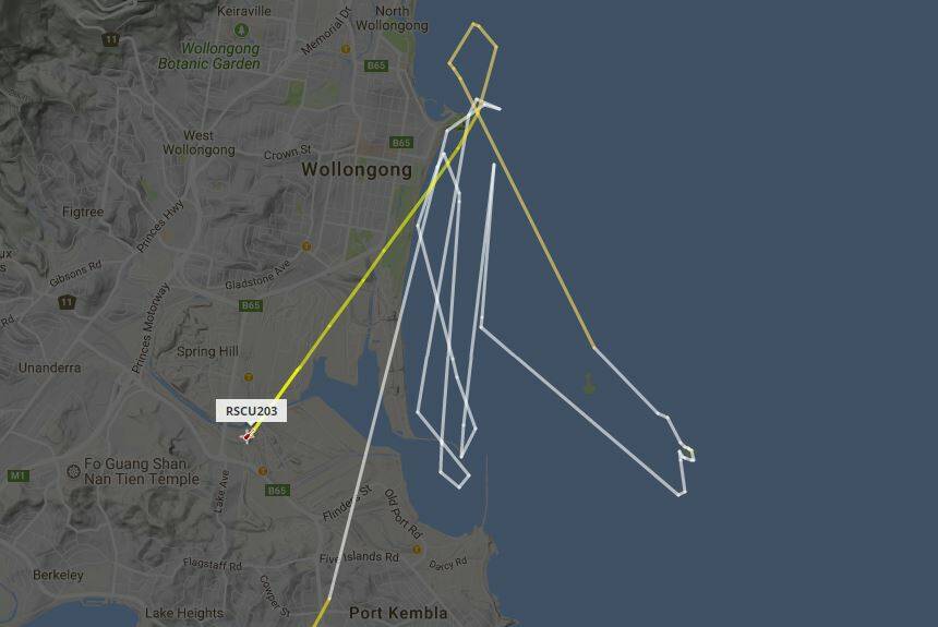 The NSW Ambulance helicopter, Rescue 203, searching the water between Flagstaff Hill and the entrance to Port Kembla harbour on Sunday night. Picture: Flightradar24