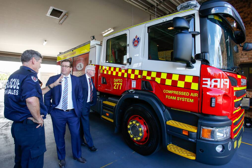 Minister for Emergency Services Troy Grant and Kiama MP Gareth Ward with Dapto firefighter Andrew Cronan at the new truck handover. Picture: Adam McLean