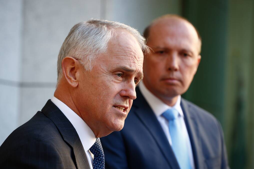 Prime Minister Malcolm Turnbull and Immigration Minister Peter Dutton address the media at Parliament House in Canberra on Tuesday. Picture: Alex Ellinghausen