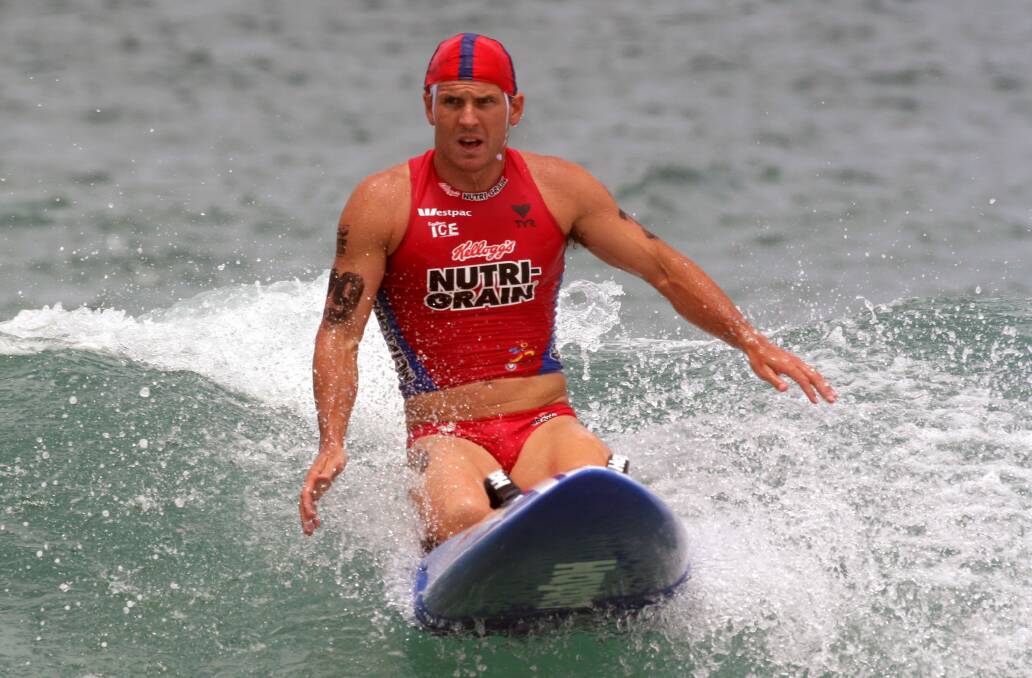 IN ACTION: Champion ironman and former Thirroul surf lifesaver Dean Mercer died on Monday.