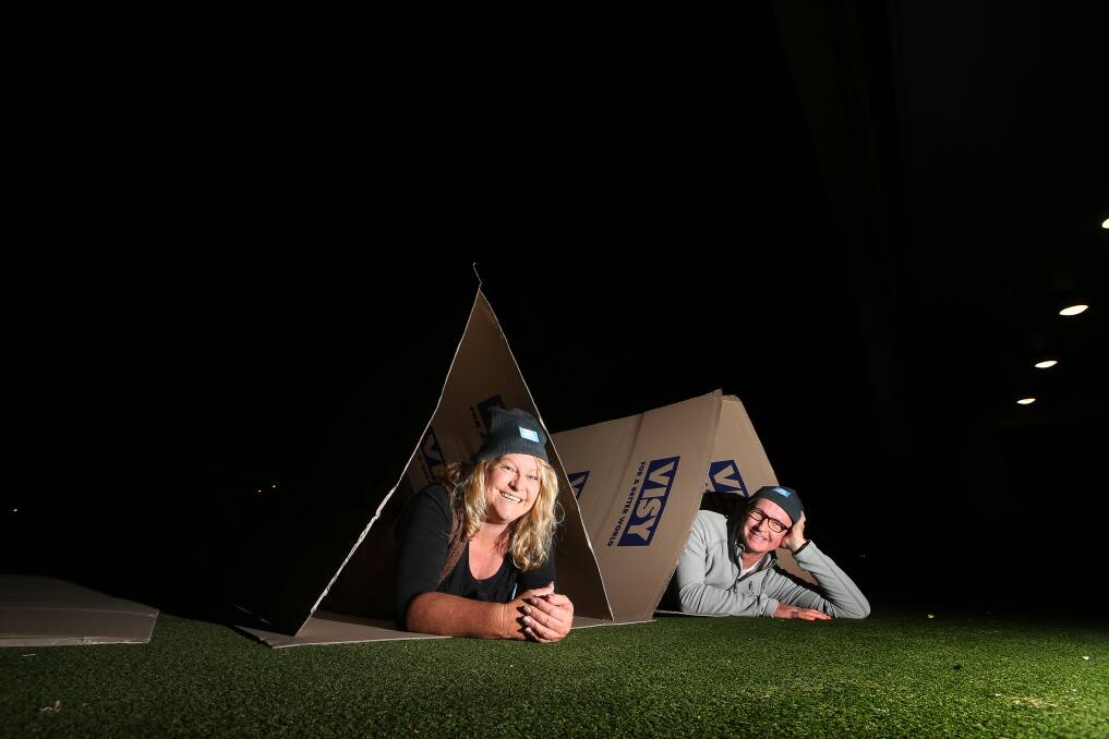 Lee Hughes from the St Vincent de Paul Society NSW with Flagstaff Group chief executive Roy Rogers for the CEO Sleepout on Thursday night. Picture: Sylvia Liber