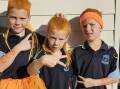 Bentley Cormack, Odie Cormack and Bowie Cormack wearing orange for WOW Day. Picture by Unanderra Public School