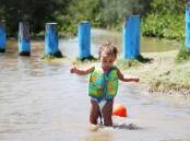 Miles Poching in the water at Minnamurra River. File picture by Sylvia Liber