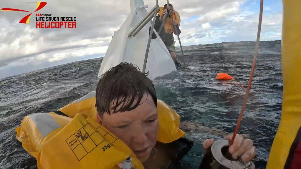 Two men and a teenager were rescued after their shark fishing boat sank off Coalcliff on Saturday, April 27, 2024. Pictures by Westpac Rescue Helicopter