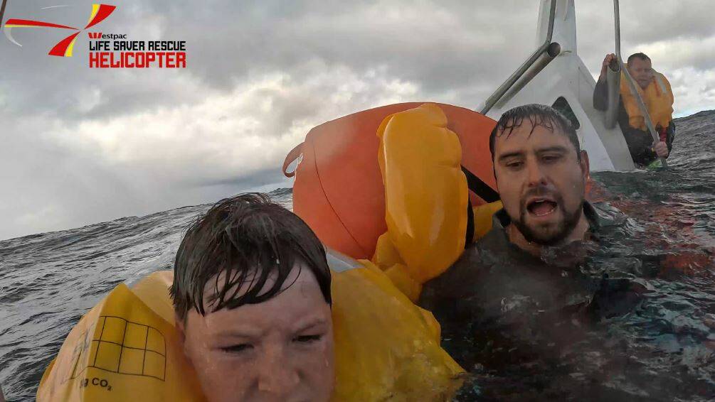 (from left) Logan Banek, James Connelly and Stuart Perry were rescued after their shark fishing boat sank off Coalcliff on Saturday, April 27, 2024. Picture by Westpac Rescue Helicopter