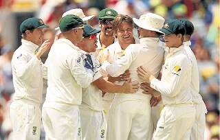 Shane Watson is congratulated for taking a wicket during the Third Test in Perth. Picture: GETTY IMAGES