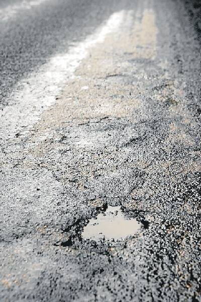 Just a week after the road was resurfaced, potholes have appeared on the Stanwell Tops road.