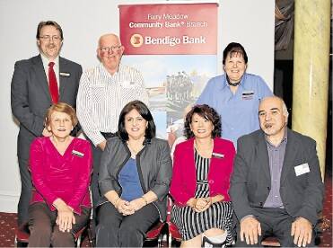 Cheers: Mark Tyson, Ray Tolhust and Valerie Hussain (back), Lucia Zanetti, Connie Saad, Jenny Costanzo and Frank Cardamone (front) at the 10th anniversary of the Bendigo Community Bank.Picture: GREG ELLIS