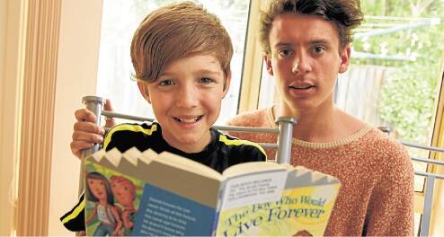 Success story: Conor Rogers, 11, has become more confident in his reading ability thanks to his mentor Clem McLernon, 16. Picture: CHRISTOPHER CHAN