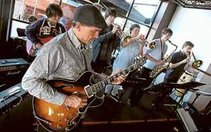 Jazz guitarist Carl Dewhurst combines with the Keira High School band at Five Islands Brewery.Pictures: KEN ROBERTSON, SYLVIA LIBER