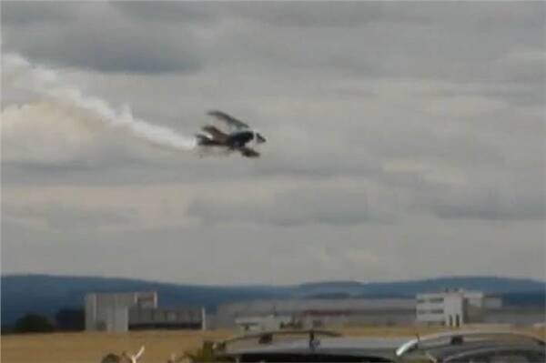 Stunt plane crashes into car in  Germany
