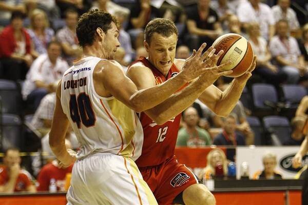 The Hawks' Glen Saville in action against the Cairns Taipans.