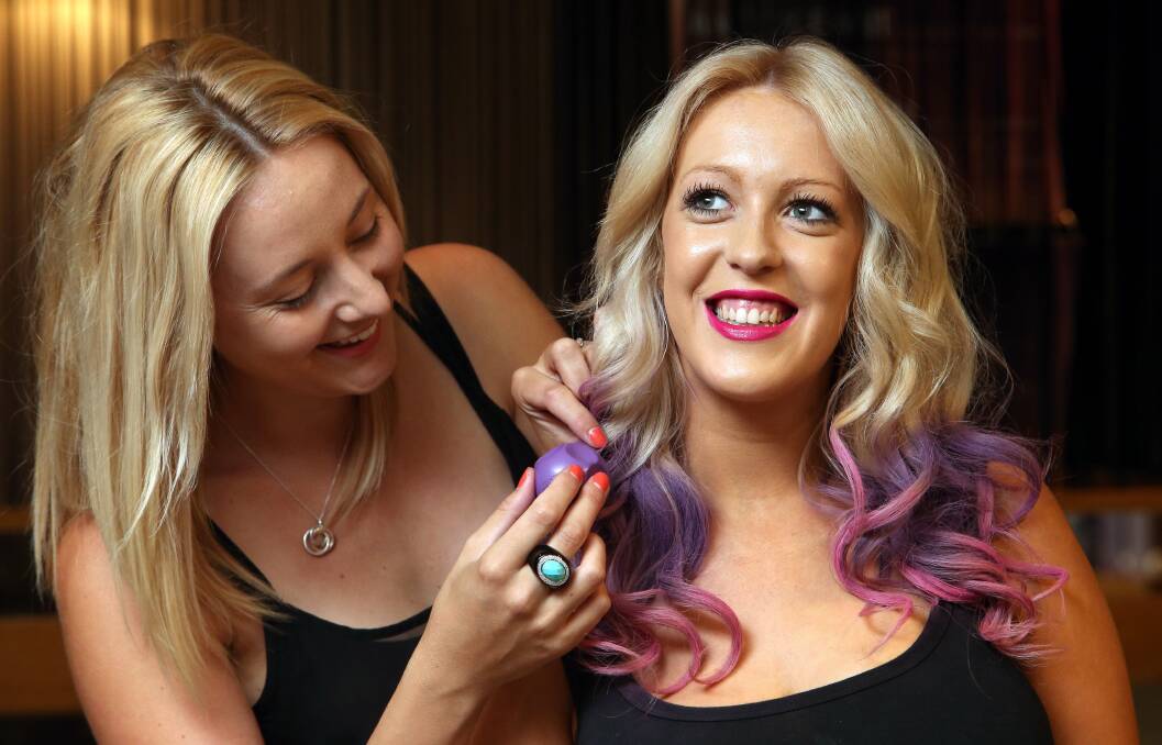 Zoe Blackburn uses the chalking method to add colour to Abby-Lee Giraldi's hair. Picture: KIRK GILMOUR.