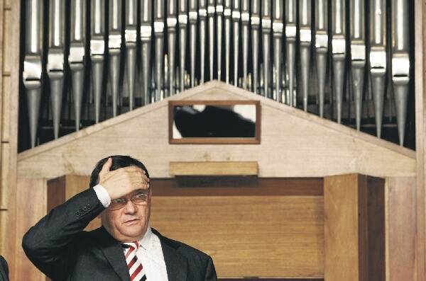 Frank Sartor stands in front of the pipe organ at the town hall. Picture: ANDY ZAKELI.