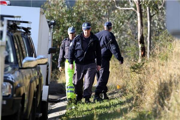 Police search for clues near Pheasants Nest Bridge. Picture: SYLVIA LIBER