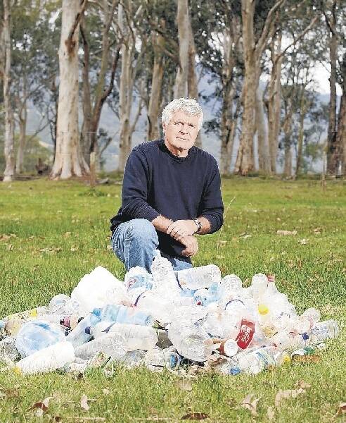 Glyn Stones, who pulled these plastic bottles from the Kangaroo River, is campaigning to eliminate the items from Kangaroo Valley. Picture: ADAM McLEAN