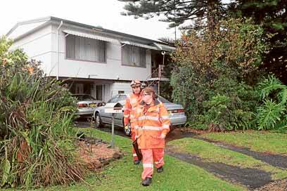SES workers informing residents of evacuation procedures last month. They were on alert for a dam bursting its banks.  Picture: KIRK GILMOUR