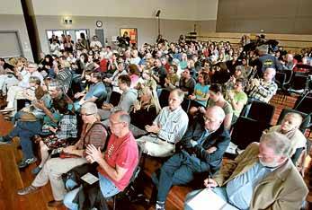 Audience members applaud a speaker at the Thirroul meeting where Ormil Energy pledged it would not "frack" Illawarra coal seams. Pictures: ORLANDO CHIODO