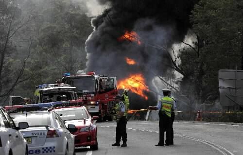 Emergency crews face a horror scene yesterday as three people die in a crash involving a fuel tanker on the Princes Hwy near Batemans Bay.
