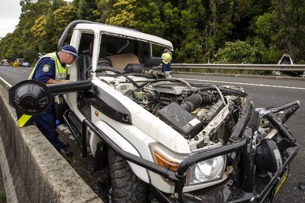 MERCURY NEWS ACCIDENT. Picture shows a car accident between a car and a truck on M1 Princes Motorway (Mount Ousley Road) near Bellambi Creek, heading northbound. Photo taken on the 9th of December, 2013. Photo Christopher Chan, story Dominic Geiger.