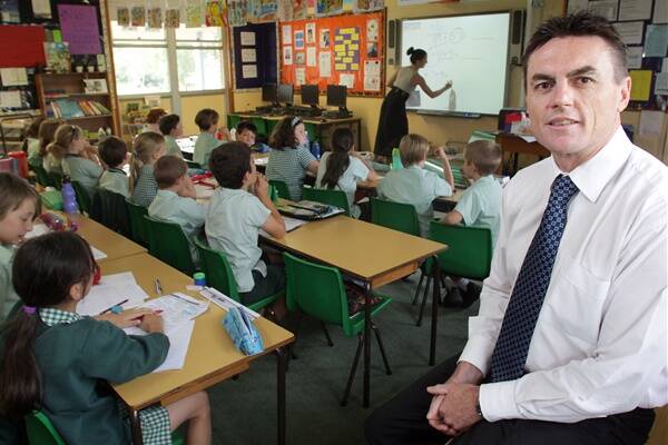 Keiraville Public School principal David O'Connor in class. He supports greater autonomy in allocating school budgets. Picture: ADAM McLEAN
