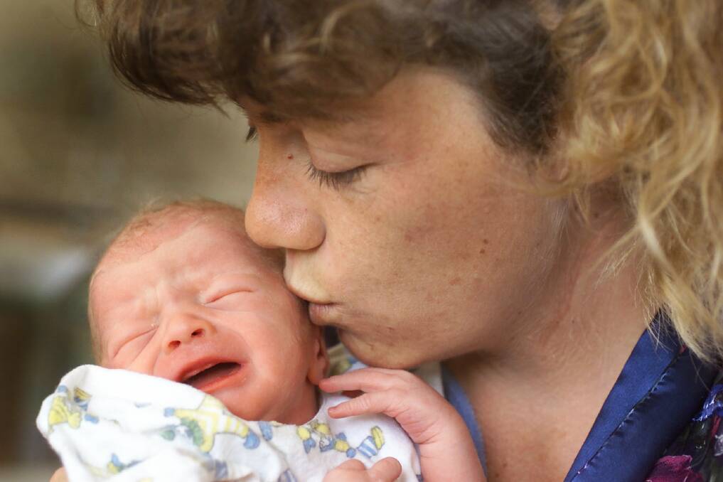 Trudy Davis with her second child, Jed, in 2002. The community helped her to go to Switzerland.