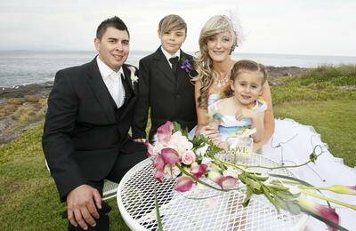 Erin and Jamie Graham at Bass Point on their wedding day with children Trey and Harlee. Pictures: DAVE TEASE