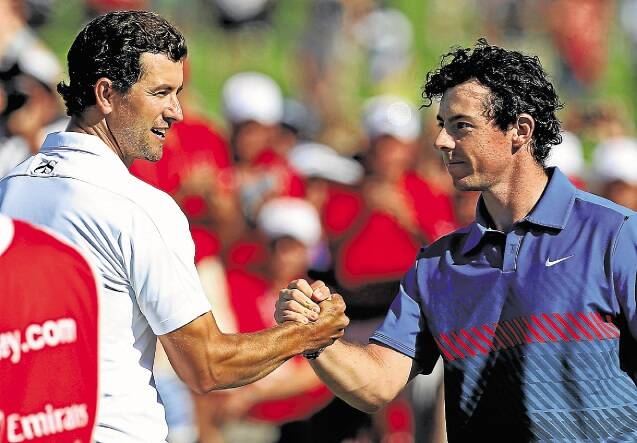 Adam Scott shakes hands with Rory McIlroy on the final hole of the Australian Open. Picture: REUTERS