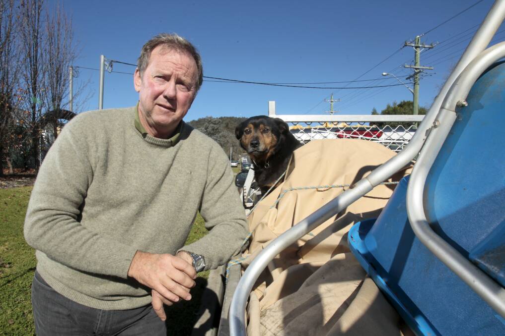 Right track: Michael Ryan and his dog Laurie. Mr Ryan says making construction companies establish trusts is a good idea. Picture: DAVE TEASE
