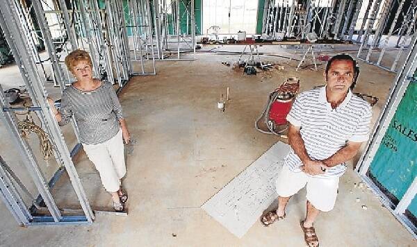 Kaylene and Ernie D'Arcangelo stand where kitchen appliances were to go. Picture: KIRK GILMOUR
