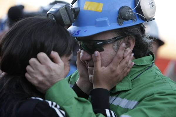 Franklin Lobos and his daughter Carolina after emeging from the San Jose mine last October.