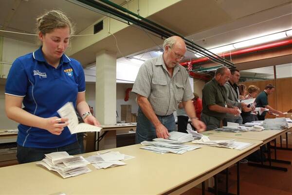 Vote counting underway at the returning office at Wollongong Town Hall. PHOTO: Ken Robertson